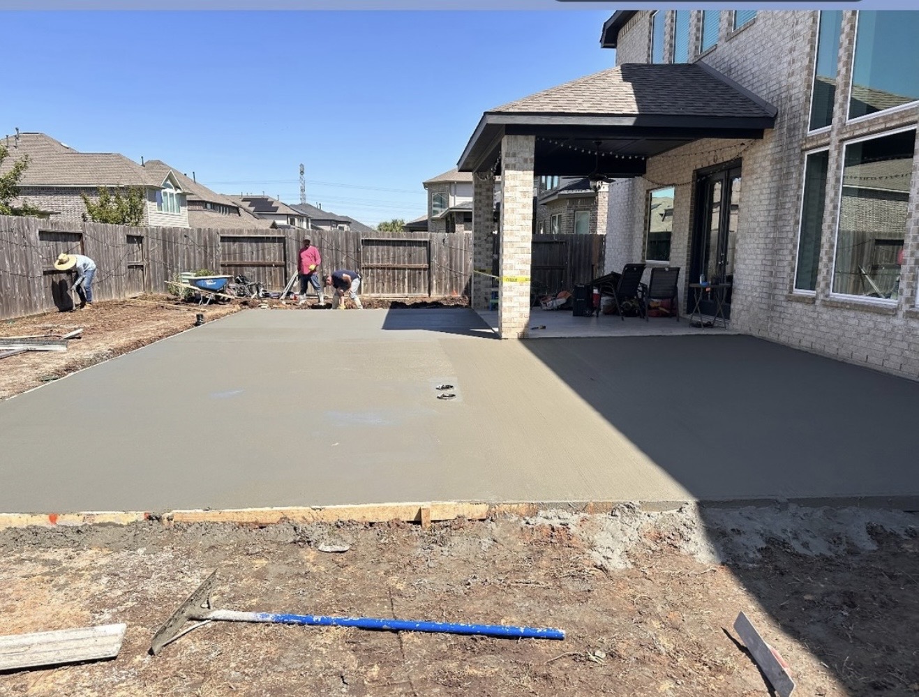 Fresh concrete patio pour in backyard
