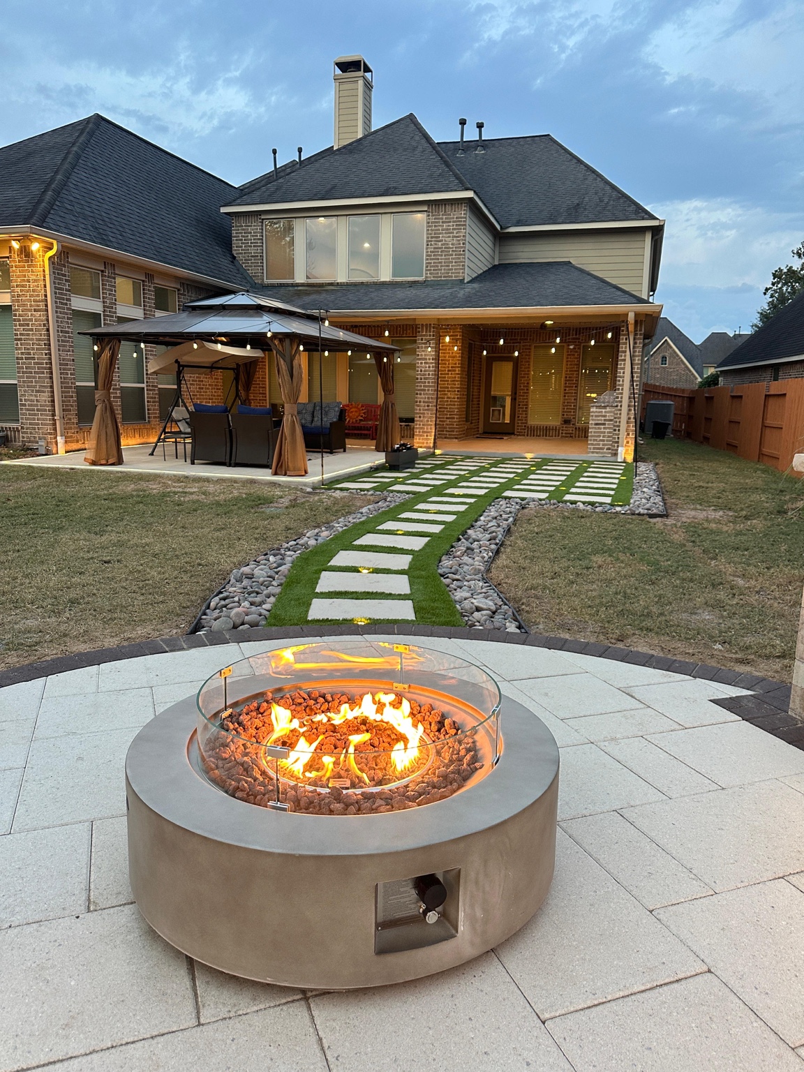Backyard fire feature with seating and lighting